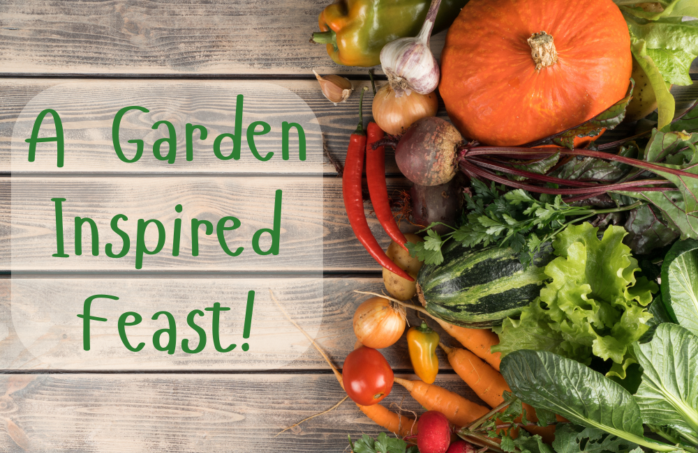 Several different garden veggies on a wooden background with the words &lsquo;a garden inspired feast&rsquo;